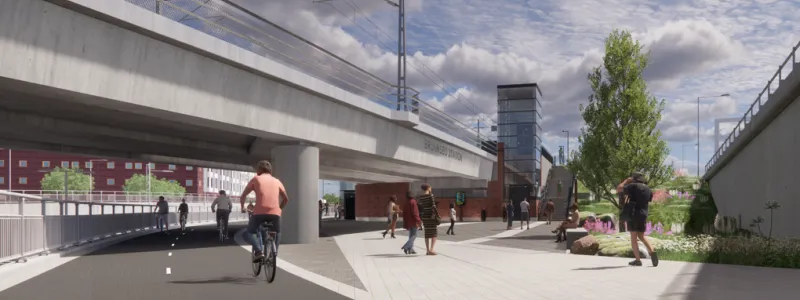 Visionsbild som visar norra entrén till Brunnsbo station sedd från Backavägen, bakom järnvägsbron skymtar bebyggelsen vid Berättelsegatan i Brunnsbo. Bild: Trafikverket