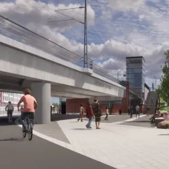 Visionsbild som visar norra entrén till Brunnsbo station sedd från Backavägen, bakom järnvägsbron skymtar bebyggelsen vid Berättelsegatan i Brunnsbo. Bild: Trafikverket
